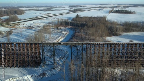 Aerial footage of the Rochfort Trestle Bridge in Alberta, Canada in winter photo