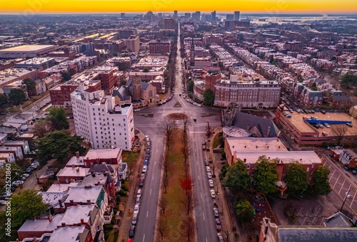 Aerial shot of a ring road and modern buildings in the city of Richmond at sunset