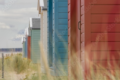 Fotografija Row of colorful beach huts in Findhorn, Scotland.