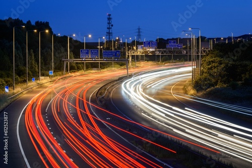 Night time traffic speeds past a junction on the M5 motorway near Bristol, UK photo
