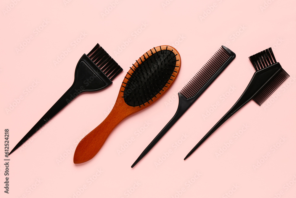 Hairdresser's brushes on pink background Hairdresser's brushes on pink background