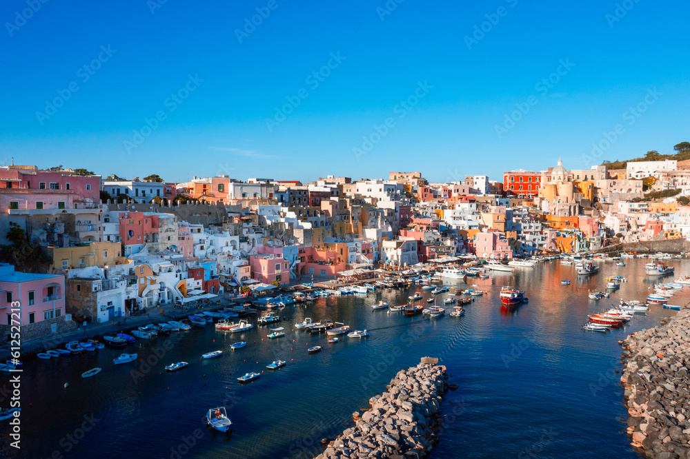 Procida colored typical houses near ocean in summer Italian vacation