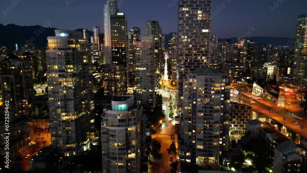 Drone view of illuminated Vancouver skyline with Granville Street Bridge at night in Canada Drone view of illuminated Vancouver skyline with Granville Street Bridge at night in Canada