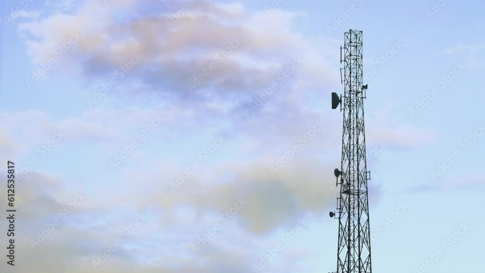Cellular communication tower against the background of the sky Cellular communication tower against the background of the sky