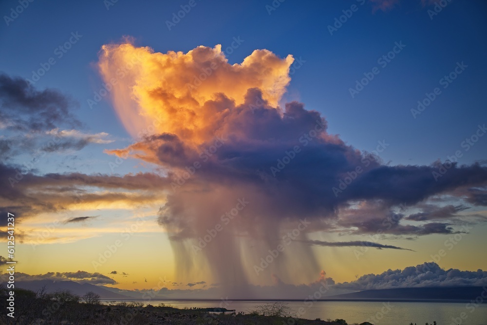 Rain cloud above Hawaii islands surrounded by highlands and clouds
