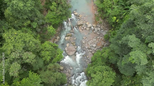 4K raising drone of trees and tropical waterfall in Perez Zeledon, Costa Rica photo