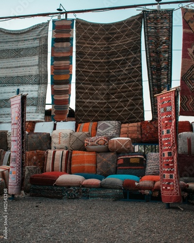 Vertical shot of the Moroccan carpets with traditional patterns in an outdoor market photo