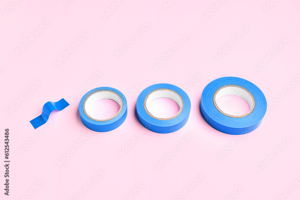 Adhesive tape rolls on pink background Adhesive tape rolls on pink background