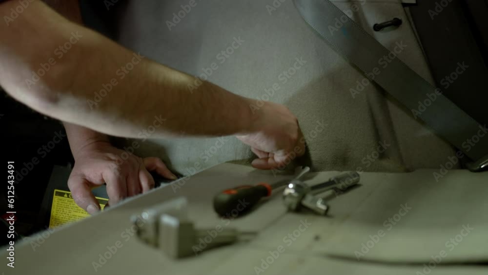 Professional car mechanic working in auto repair service Professional car mechanic working in auto repair service