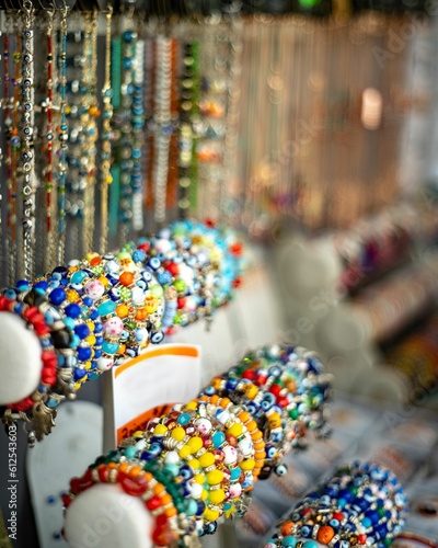 Vertical shot of bracelets displayed in a street shop