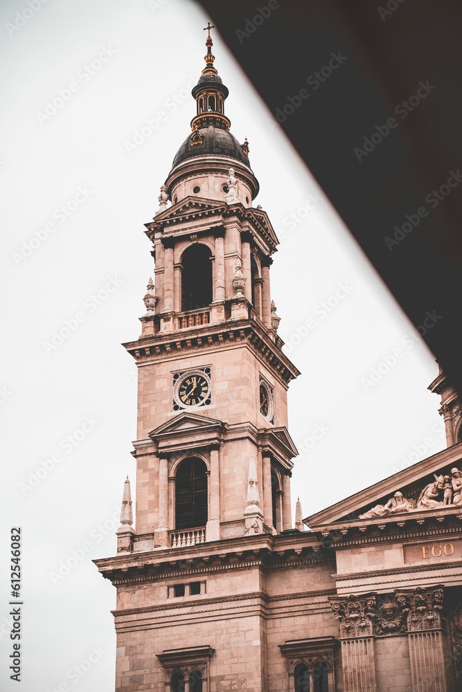 Vertical shot of the clock tower of St. Stephen's Basilica, Budapest