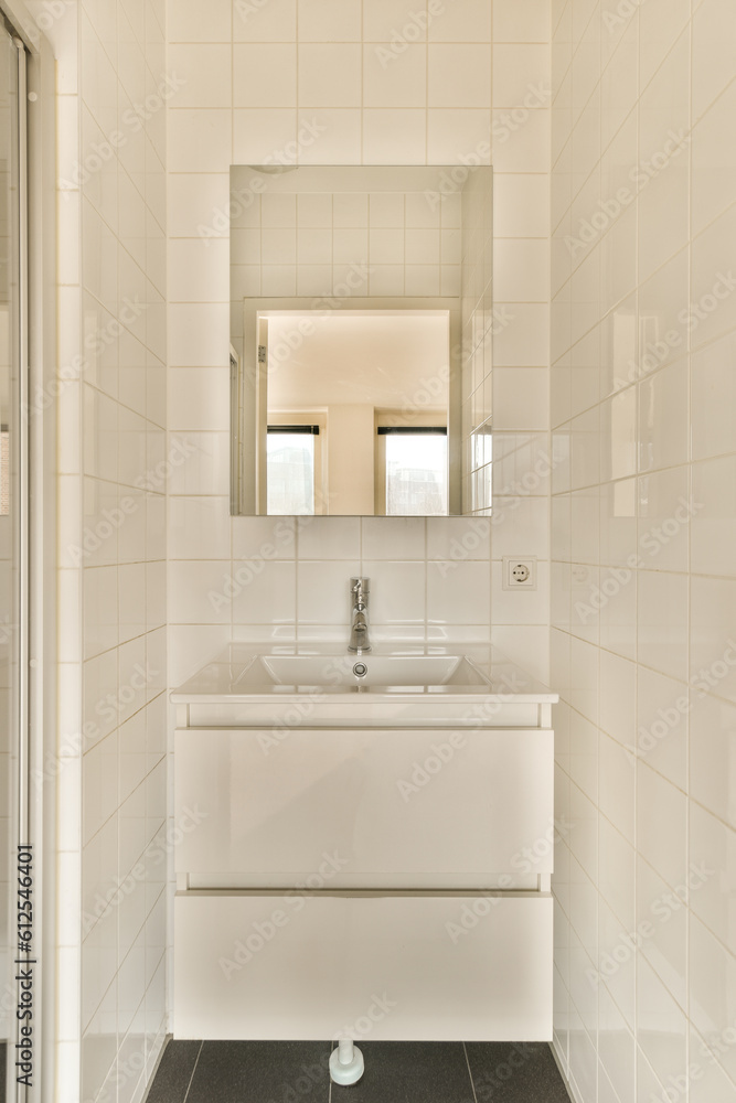 a white bathroom with a sink and a mirror a white bathroom with a sink and a mirror