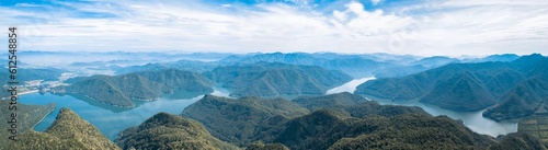 Fototapeta Naklejka Na Ścianę i Meble -  Panoramic shot of the landscape of tree hills between the lake in Taizhou