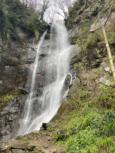 Vertical shot of the Makhuntseti waterfall near the city of Batumi, Georgia. photo