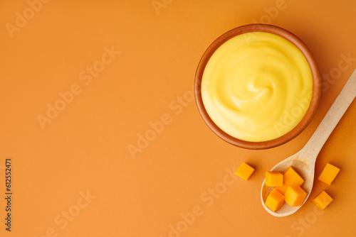 Bowl of tasty cheddar sauce...