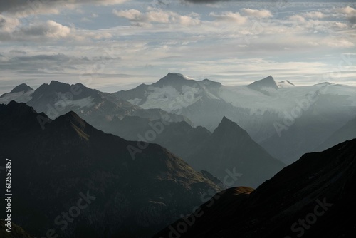 Aerial view of mountain landscape under blue sky