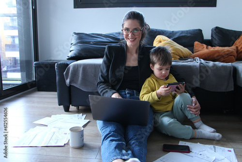 Business woman working form home with her son 