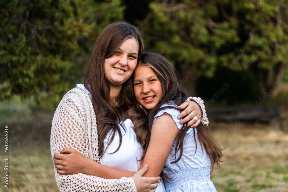 Fototapeta premium Sisters embracing 