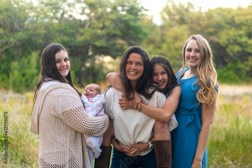 sisters and mom outside together 