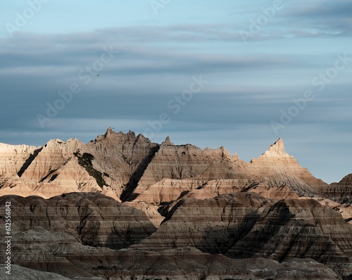 Scenic view of huge rock formations in a canyon park in cloudy sky background