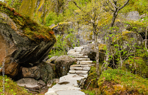 Stone steps leading towards a mountain in Svolvaer - Norway. Hike to Djevelporten along Floya trail head photo