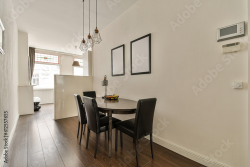 a dining room with a table and chairs and a