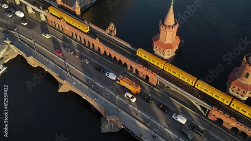 Drone view of traffic on the Oberbaum bridge over a river in Berlin, Germany photo