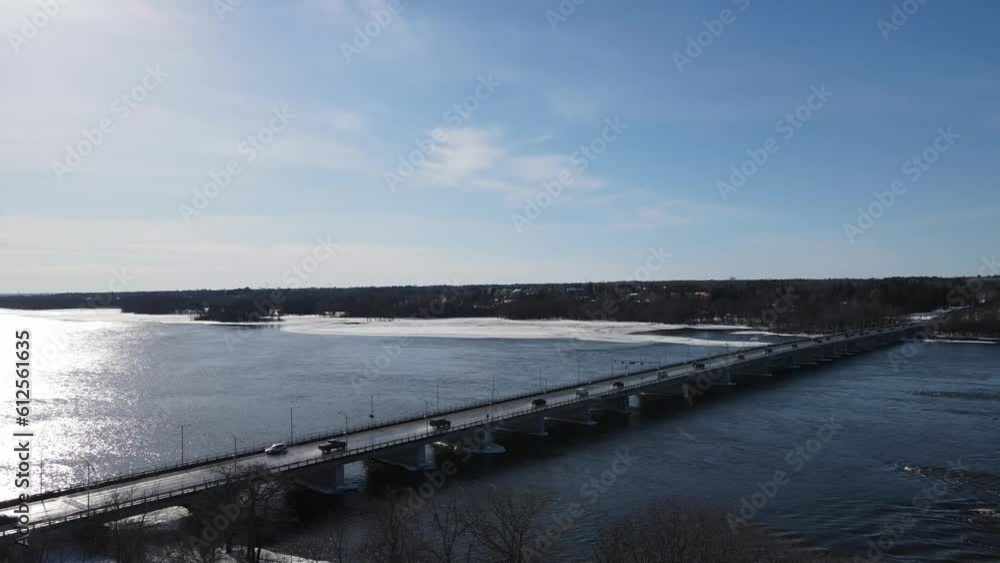 Aerial of a bridge over the wide river connecting Ottawa and Gatineau on a sunny winter day Aerial of a bridge over the wide river connecting Ottawa and Gatineau on a sunny winter day