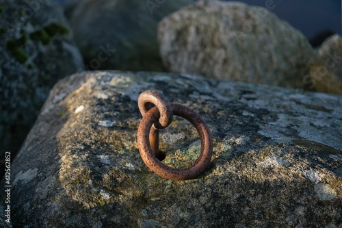 Metal ring in a stone.