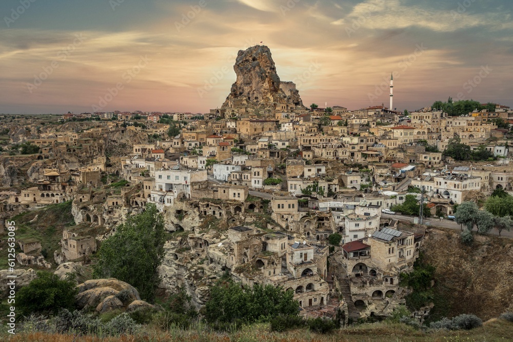 Aerial view of Ortahisar surrounded by buildings during sunset