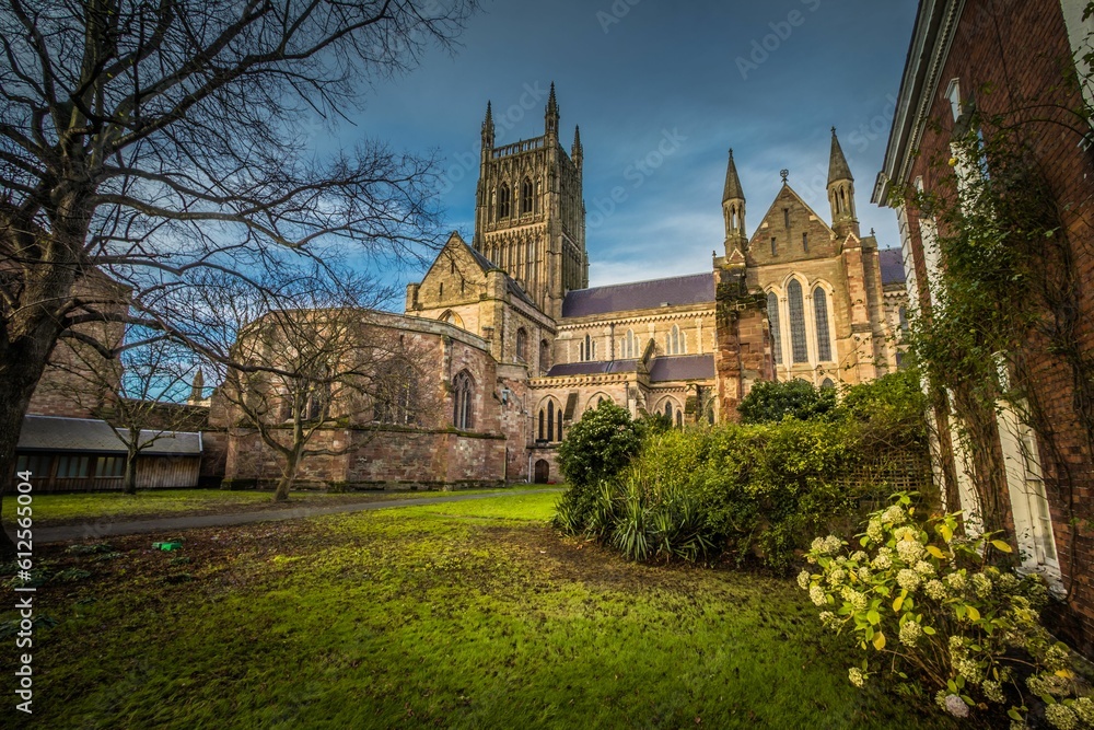 Beautiful view of the Worcester Cathedral in England, Uk with a lovely green garden