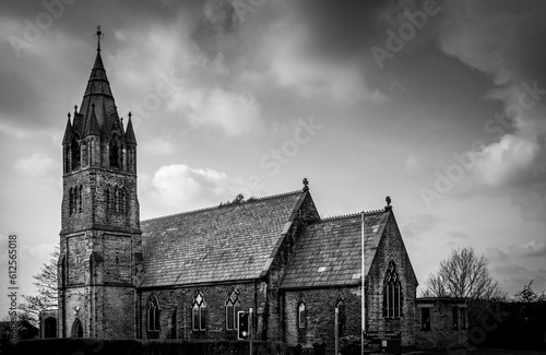 Grayscale shot of the Saint Matthew's Church under a cloudy sky in Chadderton, England
