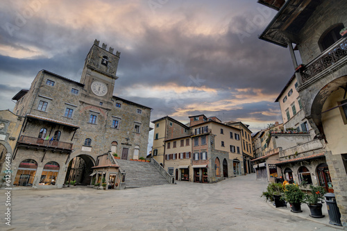 Piazza della Repubblica - the main square of the town of Cortona with a stormy clouds  photo