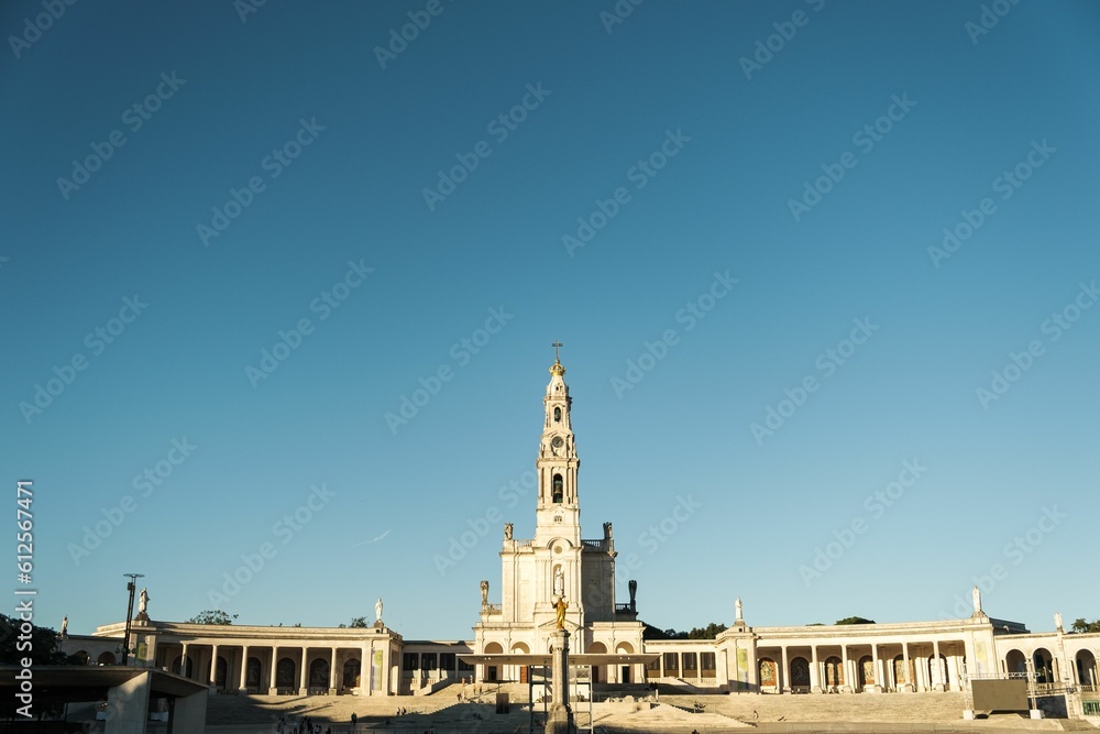 Fototapeta premium Sanctuary of Our Lady of Fatima in Portugal against a blue sky