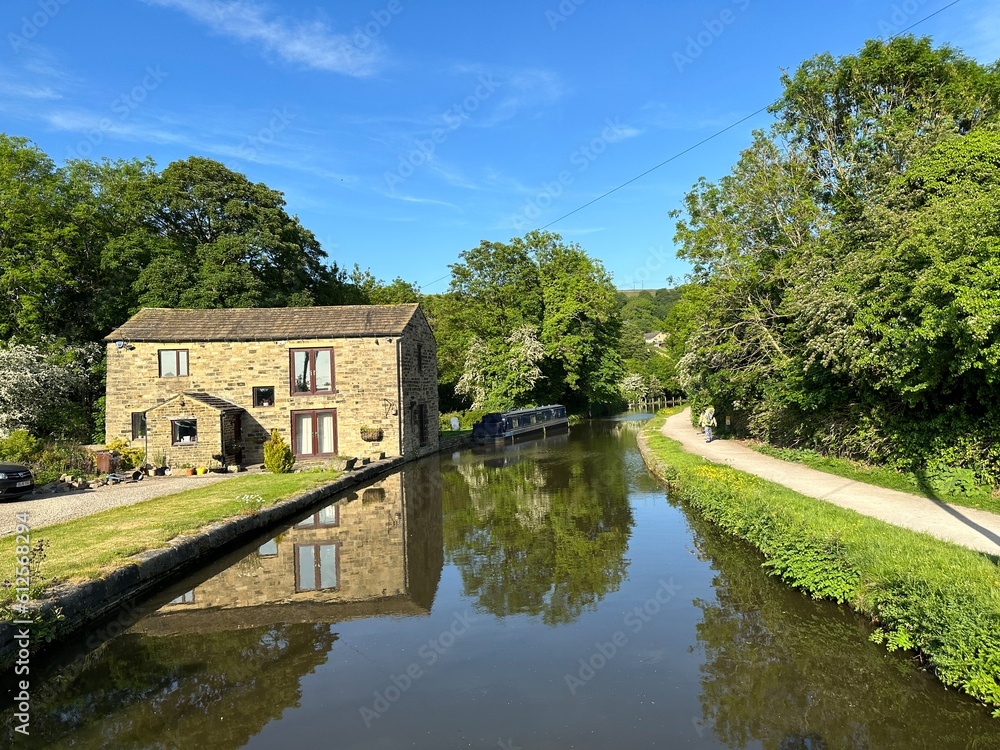 View of the, Leeds to Liverpool canal, with an old house, and a narrow boat, near, Morton Lane, Bingley, UK View of the, Leeds to Liverpool canal, with an old house, and a narrow boat, near, Morton Lane, Bingley, UK