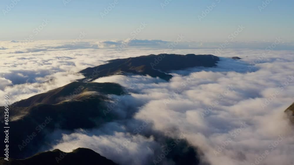 Aerial view of floating clouds over beautiful mountains on Madeira Island