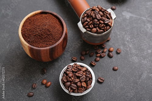 Coffee beans and powder on dark background