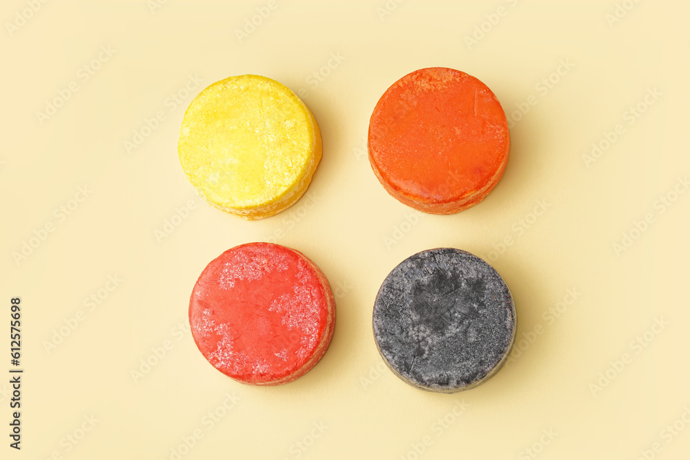 Solid shampoo bars on yellow background Solid shampoo bars on yellow background