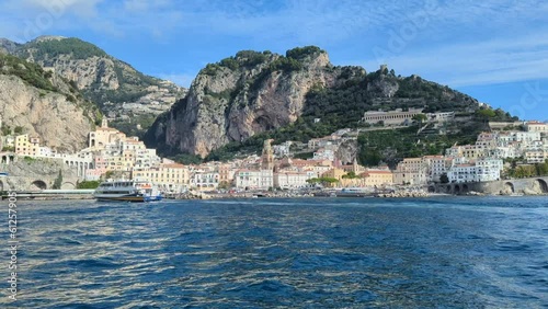 Low-angle view of modern buildings near the sea in Amalfi, Italy photo