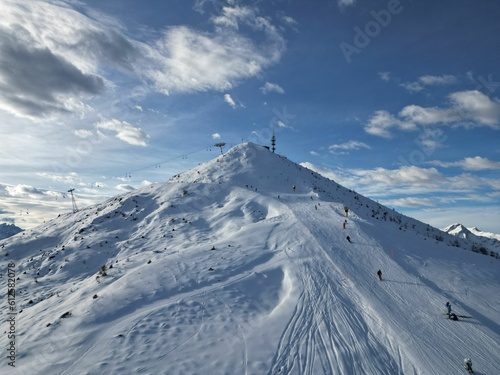 Scenic shot of snow covered mountain slope for ski sports © Vrone22/Wirestock Creators