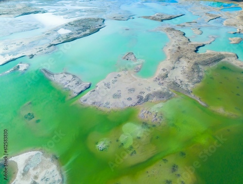 Fototapeta Naklejka Na Ścianę i Meble -  Aerial view of a stunning seascape with emerald green sea in Forggensee reservoir, Allgau