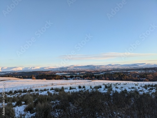Landscape view of the snowcapped fields and rocks