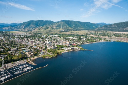 Aerial shot of the Okanagan Lake with Penticton city on the shore and hills in the background photo