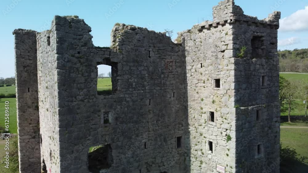 Old ruined castle in a green meadow on a sunny morning Old ruined castle in a green meadow on a sunny morning