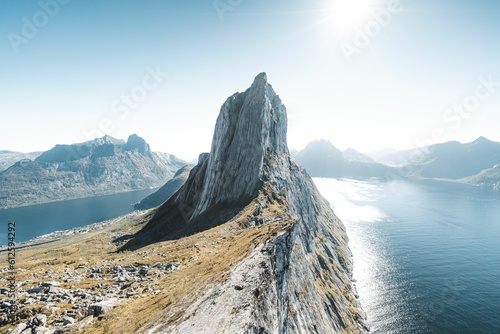 Εκτύπωση καμβά Drone shot of a huge rocky hill on the coast under the sunny sky