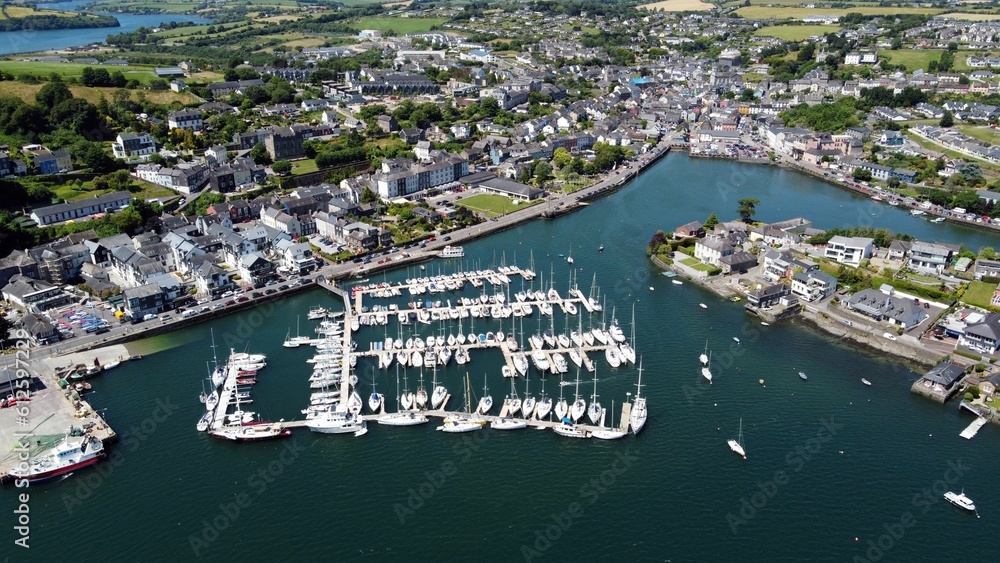 Fototapeta premium Bird's-eye view of a harbor with the background of a town in Ireland
