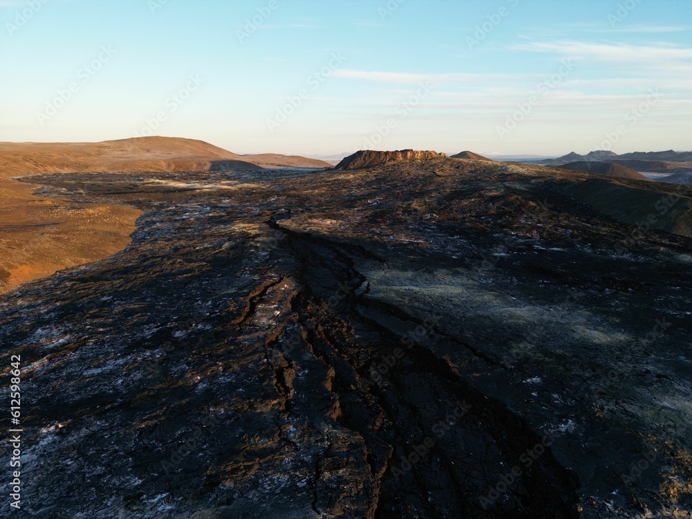 Aerial shot of the partly frozen Icelandic volcano Fagradalsfjall in sunrise
