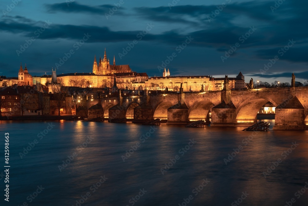 St. Vitus Cathedral with the Charles bridge at sunset in Prague by night