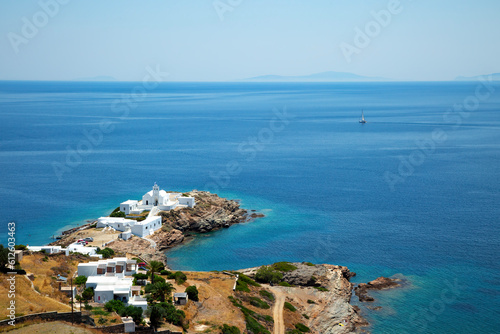 View of medieval monastery of Chrissopigi and coastline in Sifnos in Greece