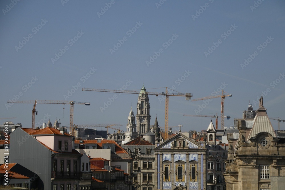 Self supporting tower cranes dominate the skyline over the center of Porto, Portugal